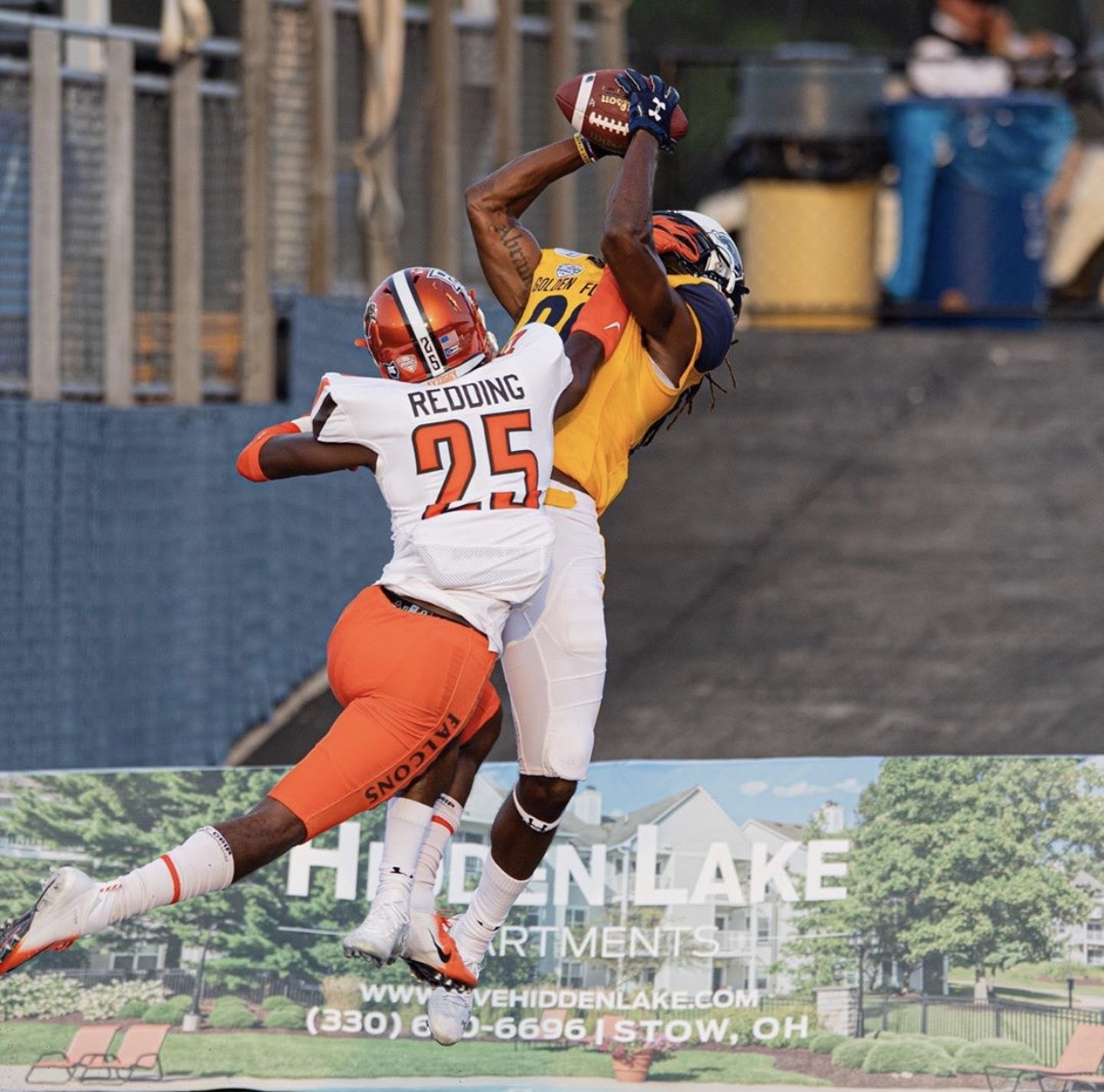 Coach Abram making a contested catch in a Kent State game